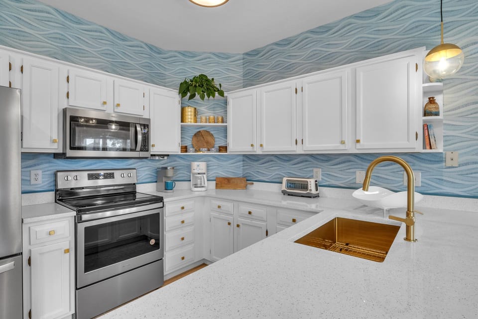 Completely redecorated and fully stocked kitchen.
