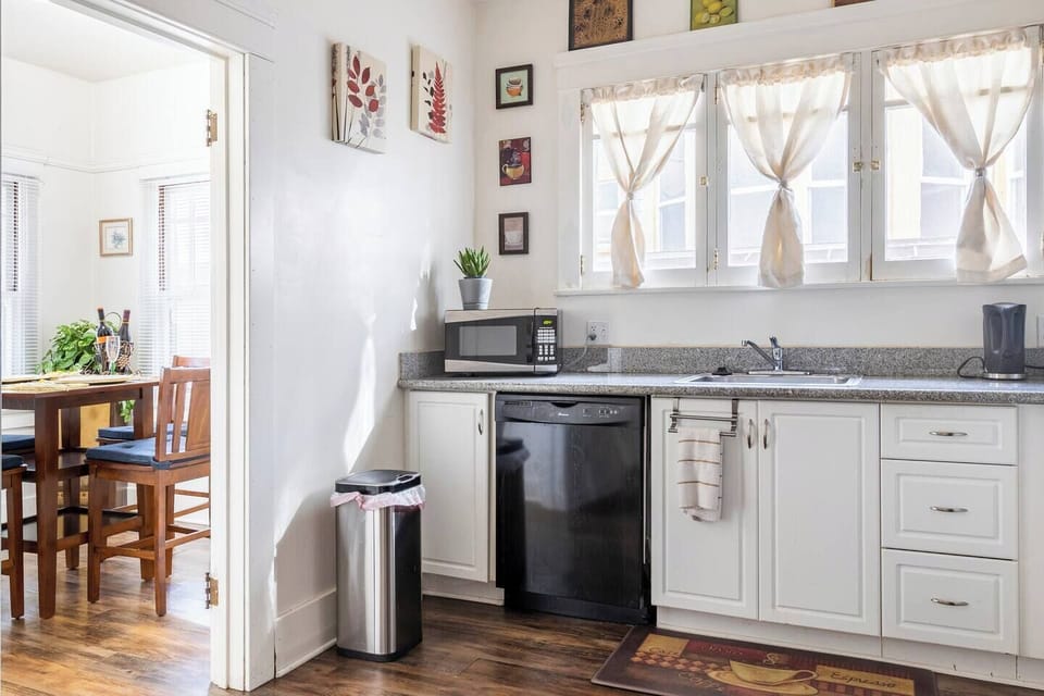 Microwave, , dishwasher, coffee bean grinder, french press, gas stove and oven, large pantry, entry way into dining area.  Very sunny spacious kitchen for cooking a meal or heating up left overs.