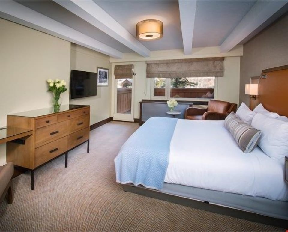 This sumptuous Guest Room is perfect for a romantic getaway, featuring rich decor and modern amenities.