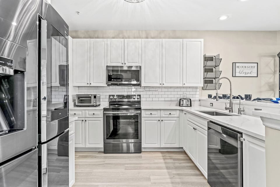 Fully loaded and stocked with every appliance you can think of to make a home cooked meal and serve your family and friends on real dishes and silverware. 