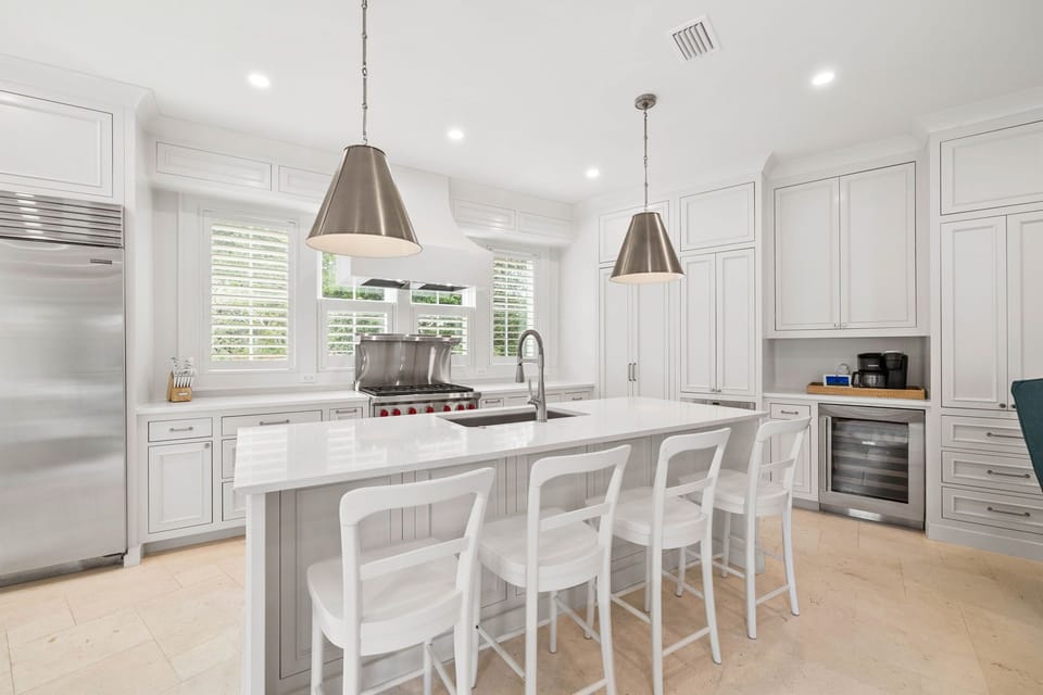 Gourmet Chef's Kitchen with Professional-Grade Appliances, Oversized Island, and Sunlit Dining Nook