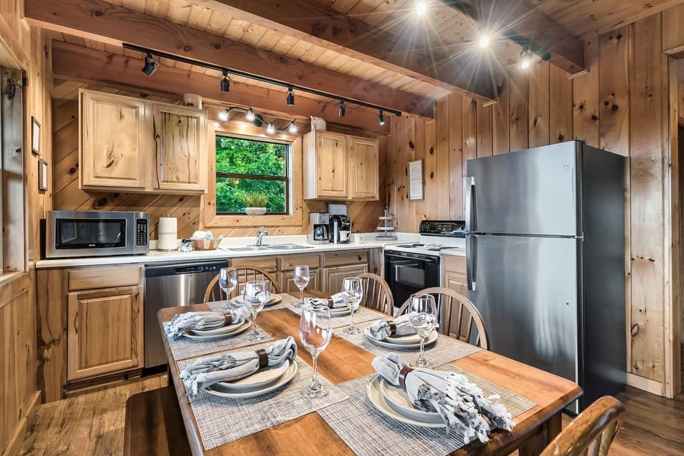 Kitchen is stocked with a full set of cookware and utensils.