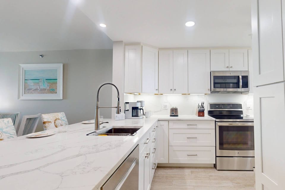 Fully Equipped Kitchen with Quartz Countertops and Stainless Appliances
