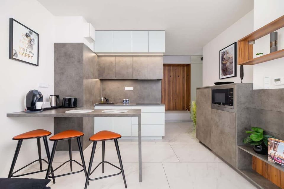 A compact yet stylish kitchen setup, with practical storage and bright accents.
