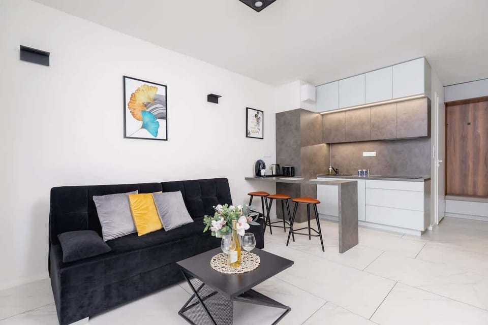 Another view of the living room, emphasizing its spacious layout and connection to the dining area.
