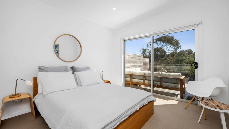 Queen bed, balcony access and a built-in robe