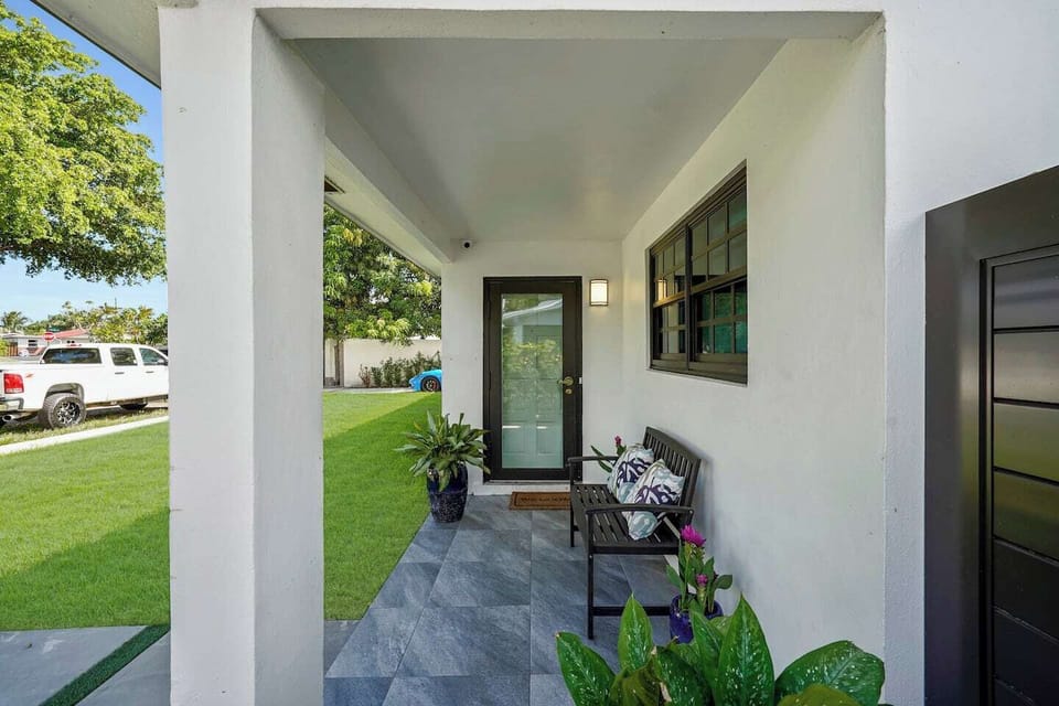 A small chair to relax in front of the front door with the street view. UNIT A