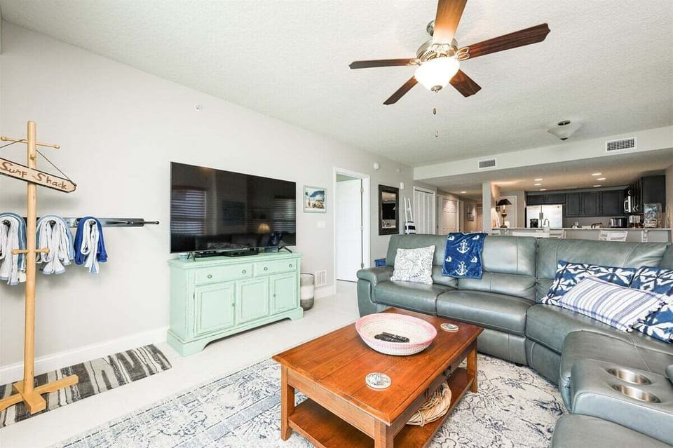 Relax and watch your favorite movie or show after a long day in the sun in this beautiful living room