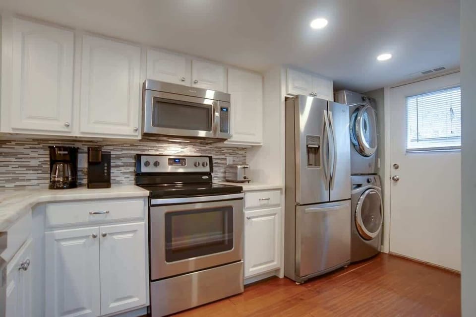 Your bright kitchen comes complete with modern appliances and a convenient washer-dryer combo for extended stays.