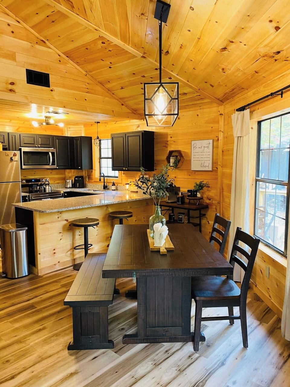 Open concept dining room/kitchen. Bench and chair seating as well as adjustable barstools at the counter!