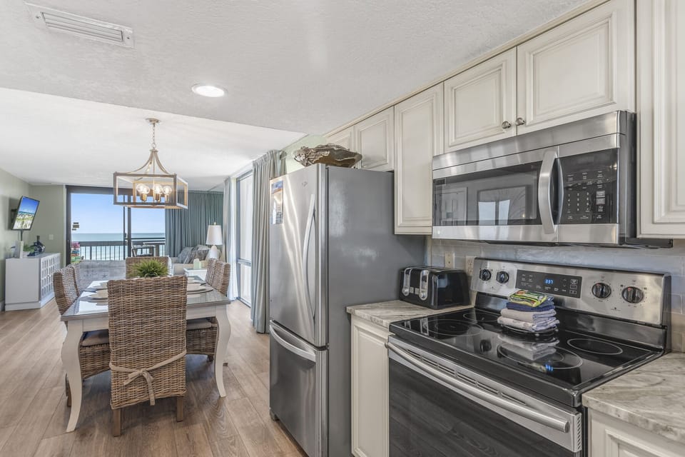 Remodeled kitchen has new countertops, stainless appliances, and is fully stocked so you can prepare meals in your home away from home!