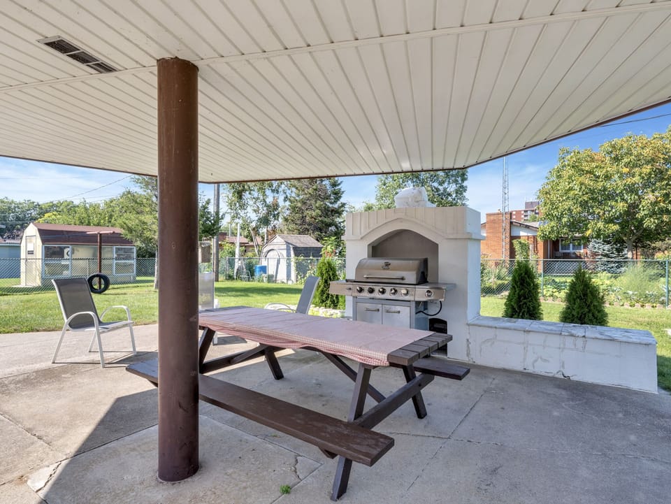 Shaded BBQ and seating area.