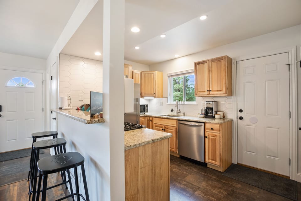 Barstools to perch on and converse from while food is being prepared.
