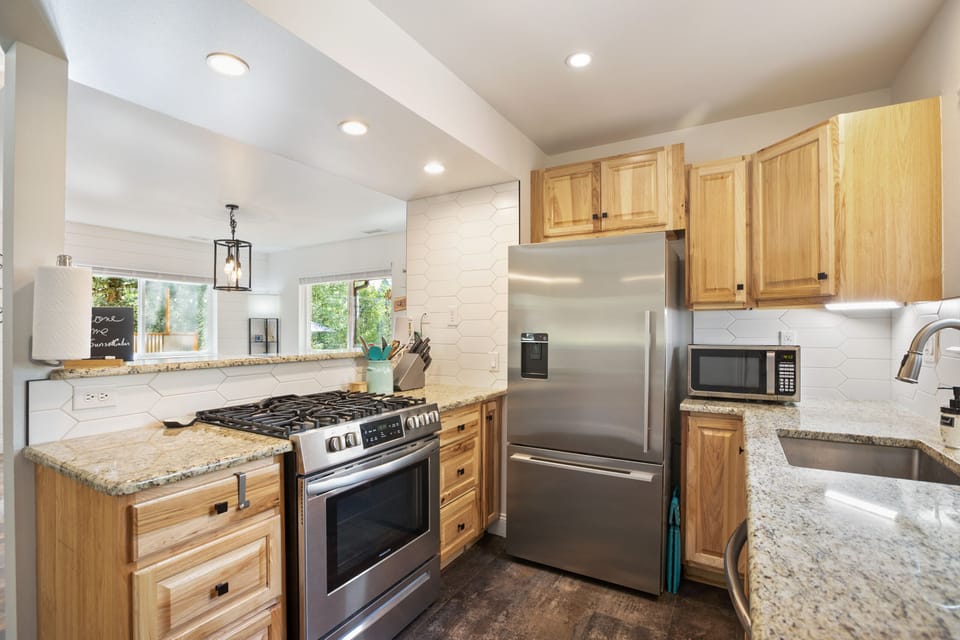 Spices, utensils, cookware, a gas range, microwave & fridge at your fingertips. 