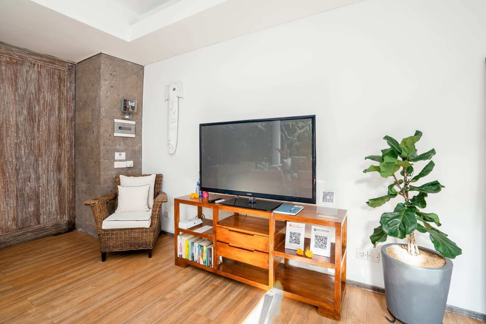 Basic Villa, 1 King Bed | Living area | 52-inch Smart TV with digital channels, streaming services, stereo