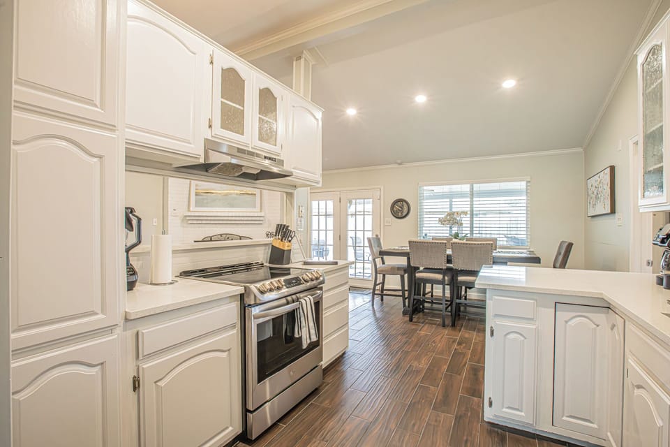 Fully stocked kitchen with dishes, pots and pans, crock pot, blender, utensils, seasonings such as salt and pepper and all the odds and ends