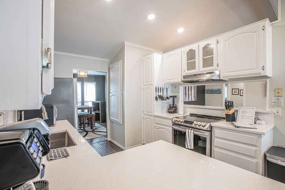 Fully stocked kitchen with dishes, pots and pans and all the essentials
