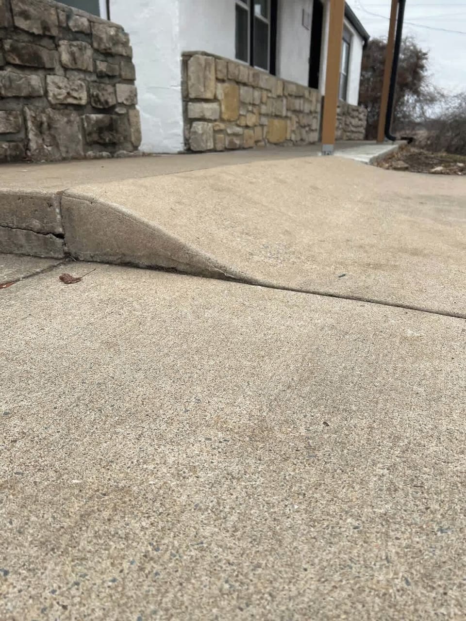 Ramp up from driveway to walk way to enter home 