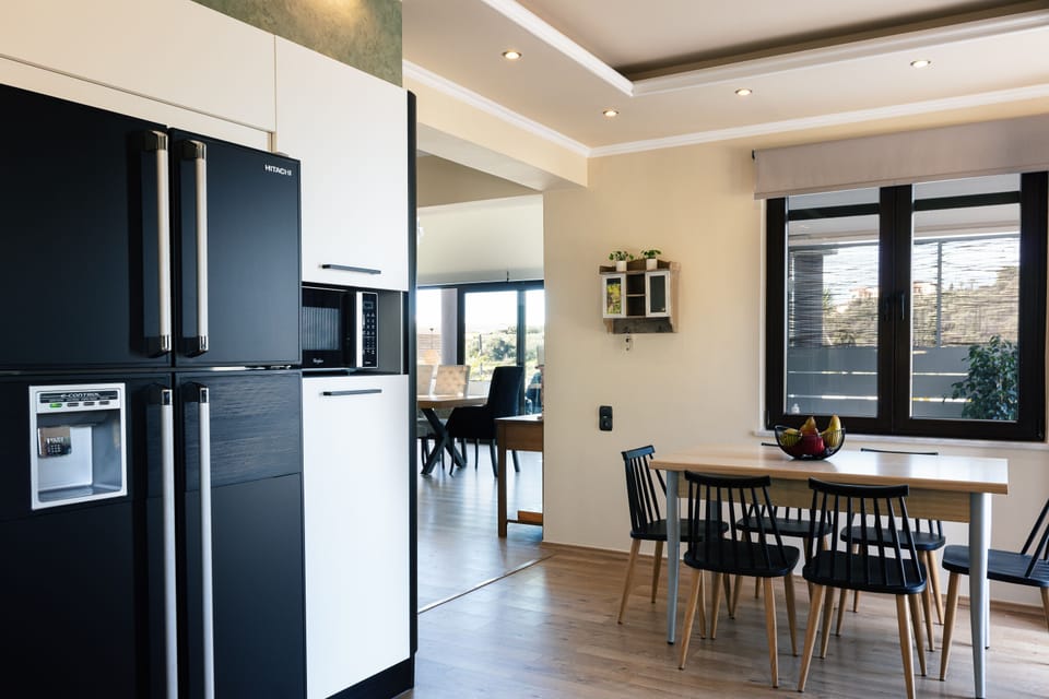 The kitchen features high-quality built-in appliances, providing all the essentials for a self-catered holiday