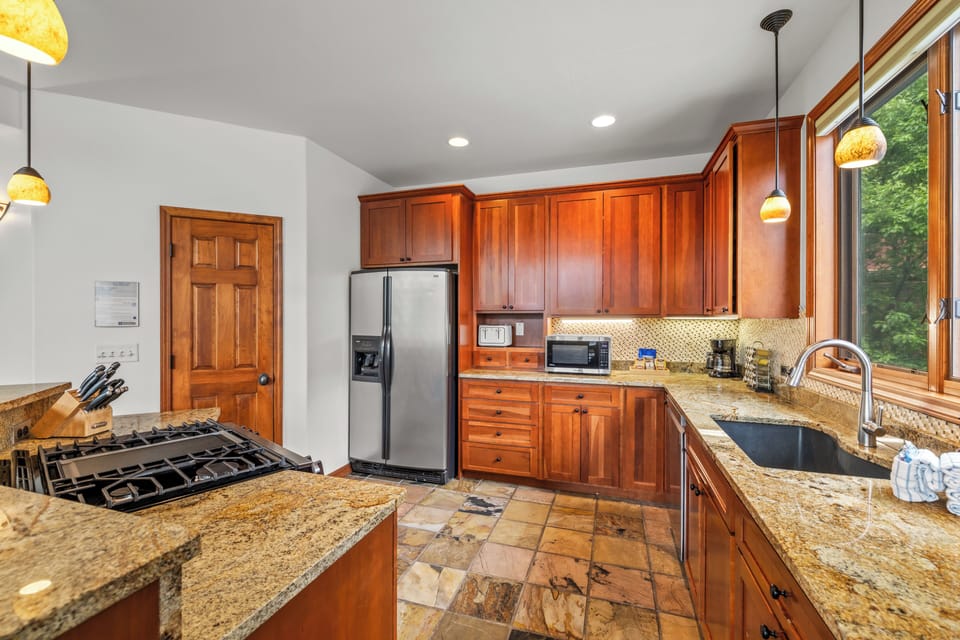 Cook with confidence in the fully stocked kitchen, complete with updated appliances and ample space for meal preparation