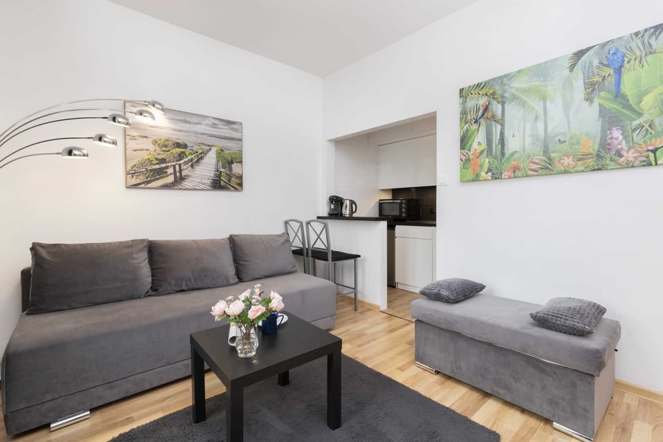 A wide angle of the living room, highlighting the seating area and stylish decor.
