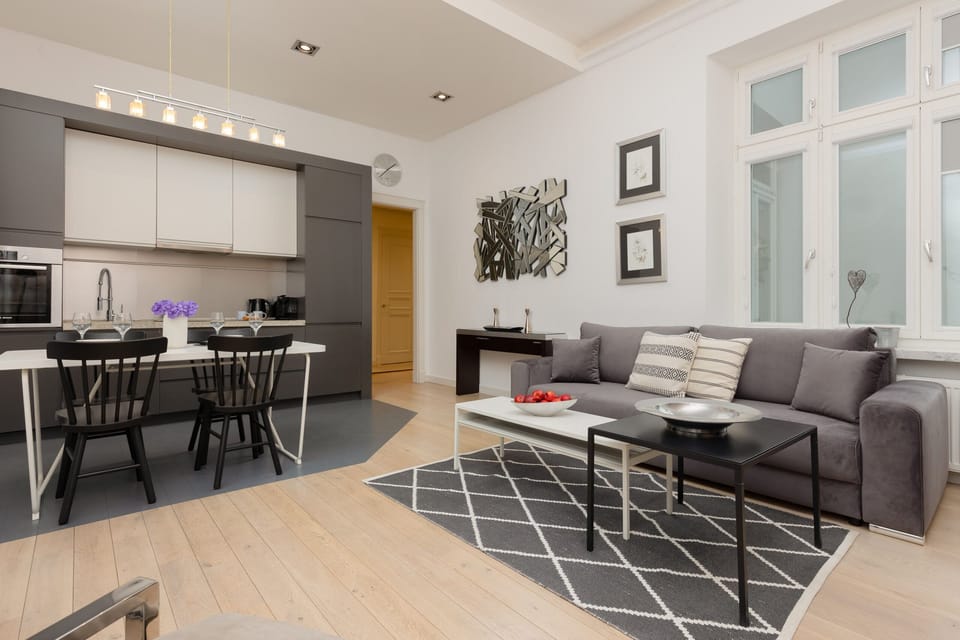 Another view of the open-plan dining and living area, emphasizing its spacious and cohesive design.
