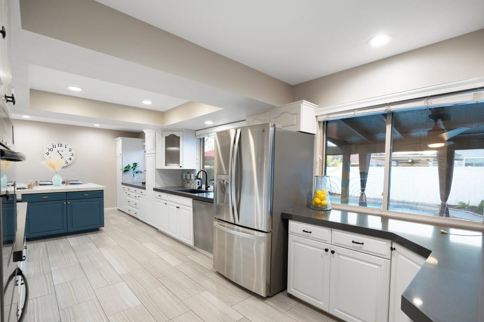 Chef's kitchen and large island seating. Full coffee/tea station. 