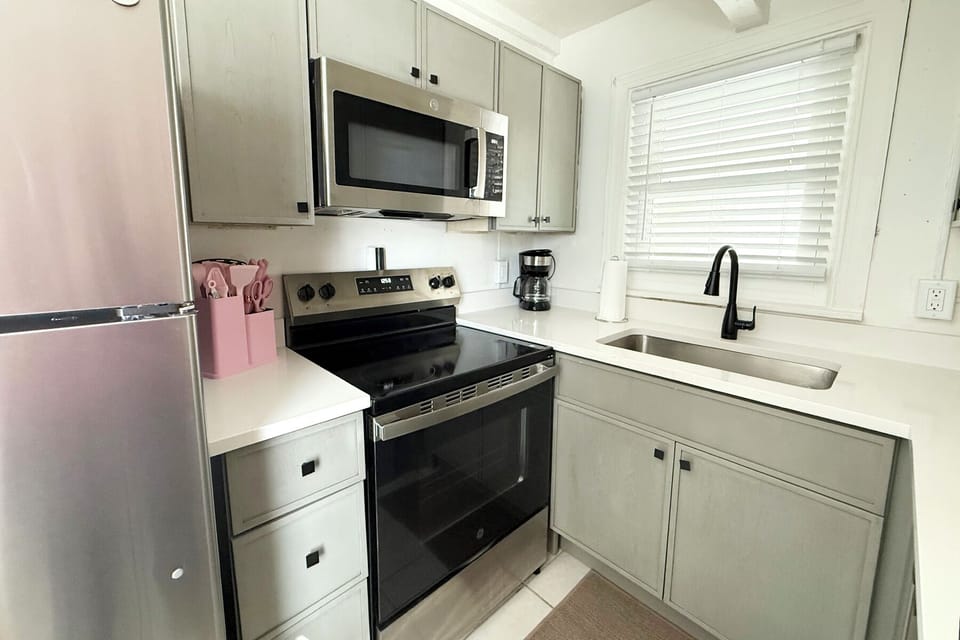 All of your basic supplies are provided in this newly renovated kitchen, including a full size fridge, oven/stovetop, and microwave, and drip coffee maker.