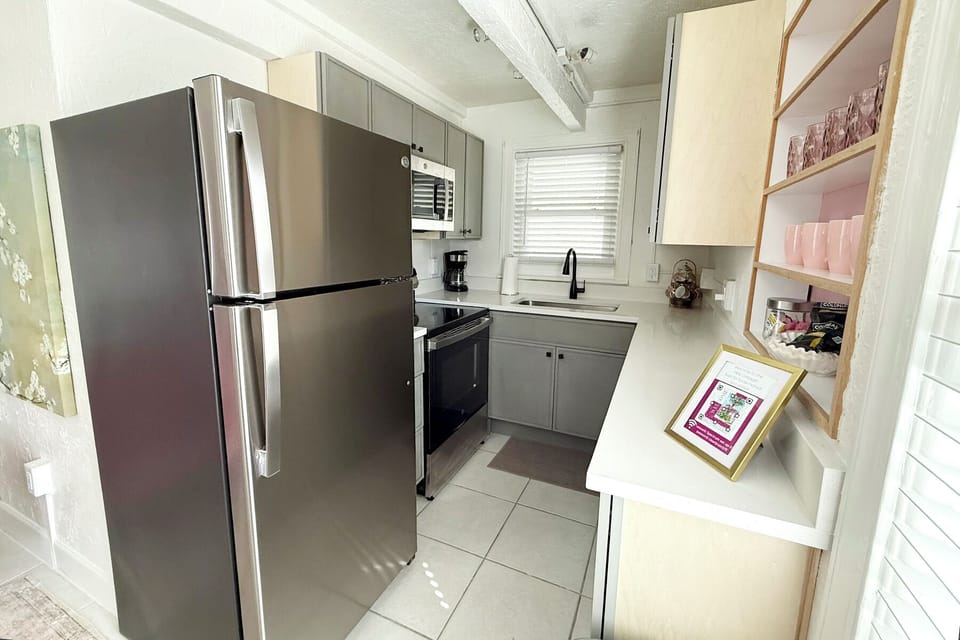 The updated kitchen is fully stocked with all the supplies you will need if you want a home cooked meal- including a full size fridge, a variety of baking dishes, pots and pans, measuring cups, plates, glasses, wine glasses, etc.