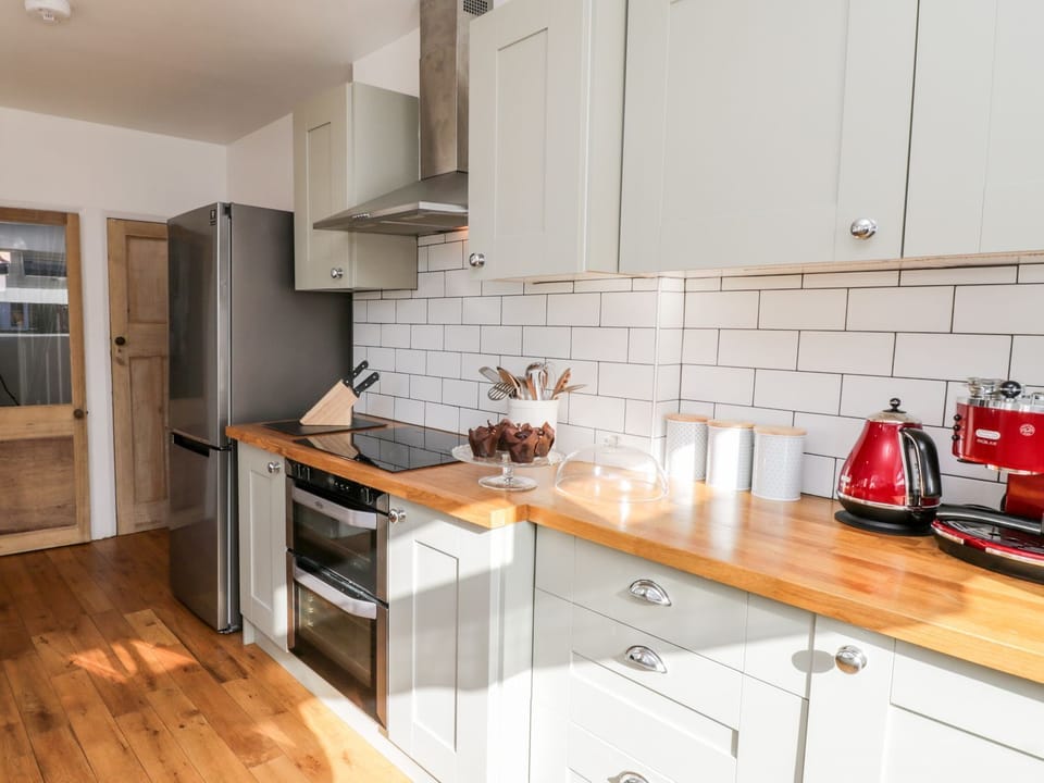 Fridge, electric kettle, cookware/dishes/utensils