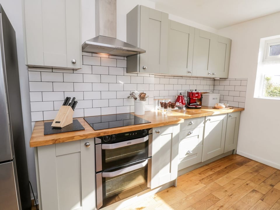 Fridge, electric kettle, cookware/dishes/utensils