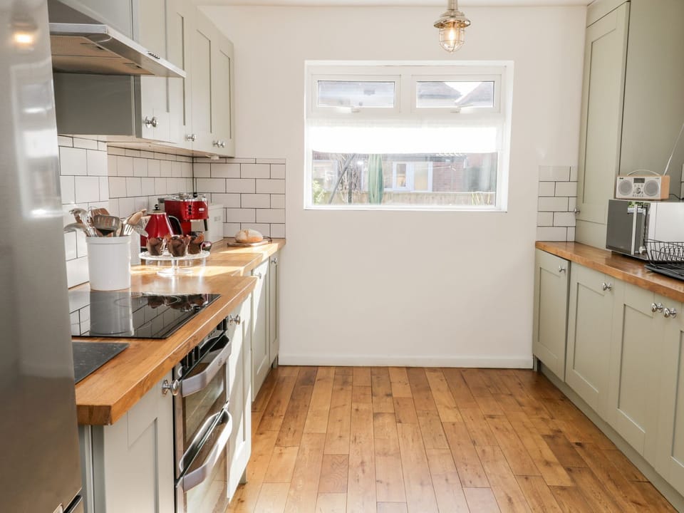 Fridge, electric kettle, cookware/dishes/utensils