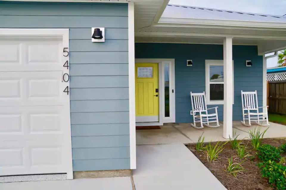 Front door with a keypad for self-check-in.   Relax on our two rocking chairs.