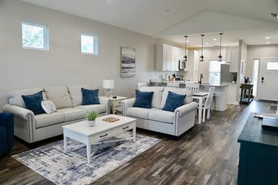 Open-concept living room and kitchen, with a 54" smart tv & board games to enjoy