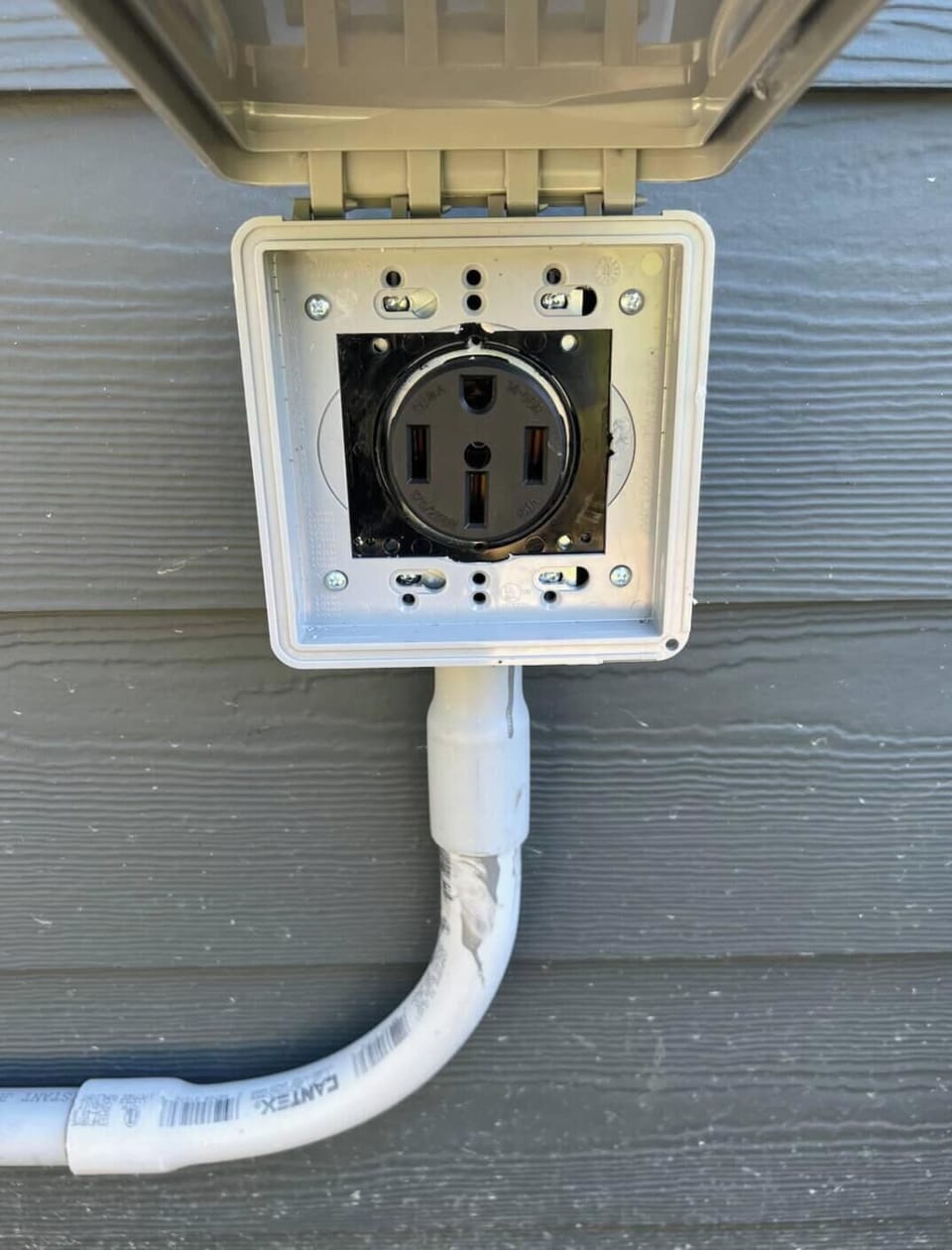220V plug w Tesla cord. Bring an adapter if you don’t have a Tesla 