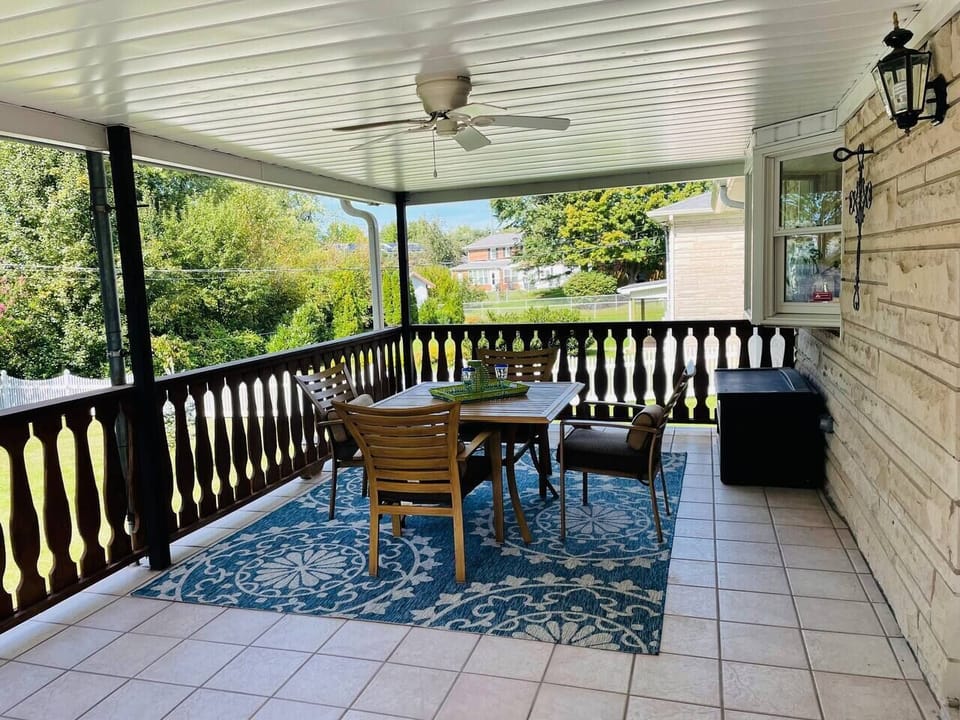 Huge tiled balcony overlooking quiet back yard makes this a great place for reading, board games, meals and more!