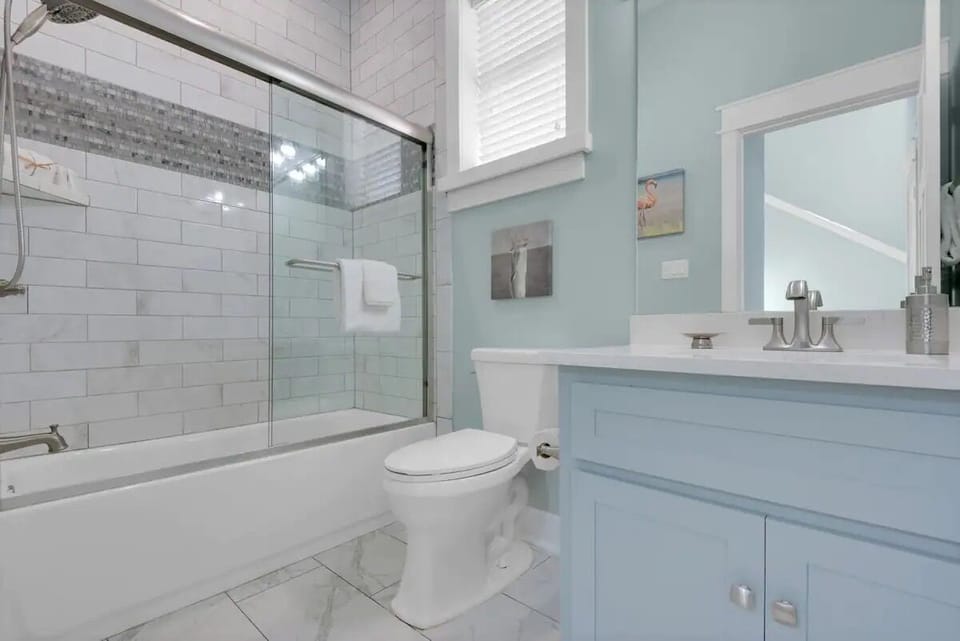 First floor. Full bath with custom tile surround.  