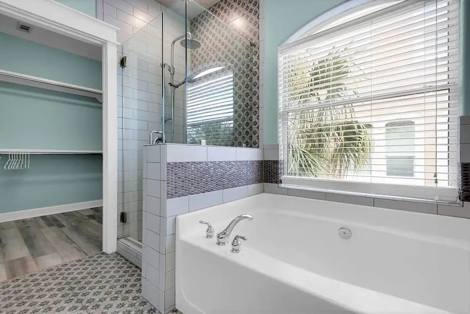 2nd floor king master private full bath with bathtub and frameless glass shower
