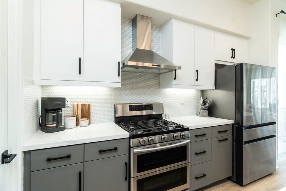 Sleek kitchen w/ stainless appliances & ample counter space for easy cooking