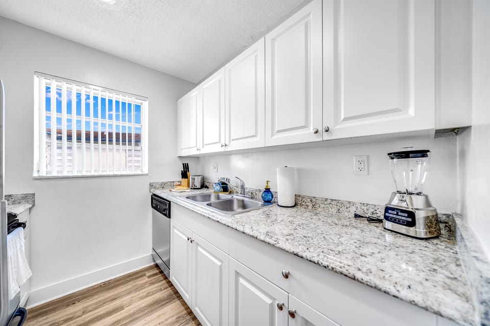 Marble top kitchen with built-in cabinets