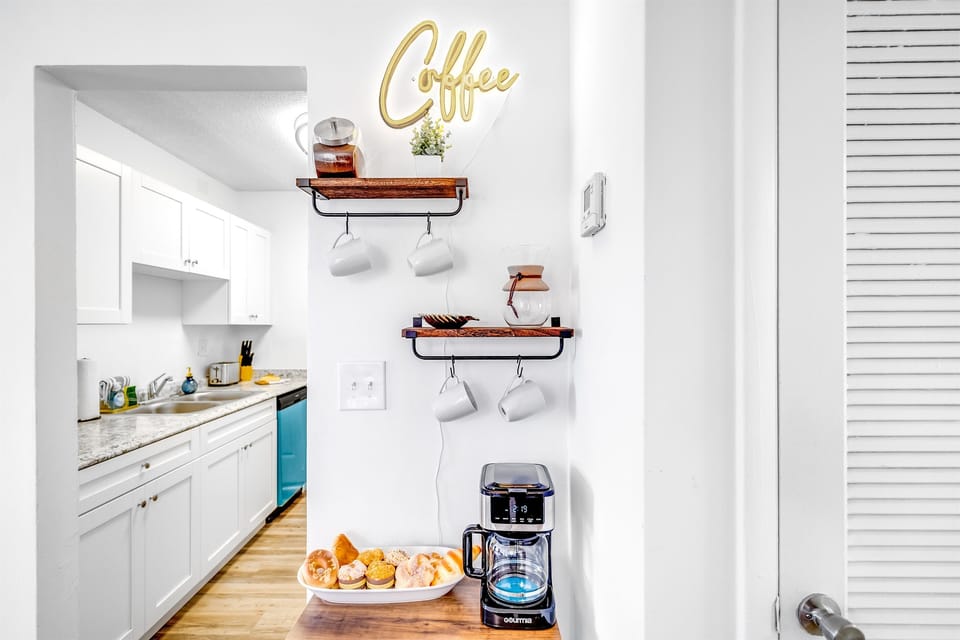 Nothing's cozier than a hot cup of coffee, right? At Palm Wave Stays, every unit comes with a coffee station for ultimate relaxation. Curl up with a book or your fave series & let your caffeine kick in. Book now! www.palmwavestays.com