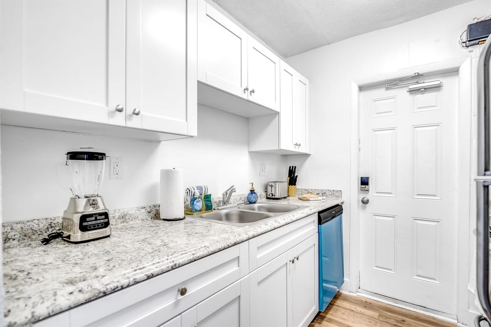 Marble top kitchen with built-in cabinets