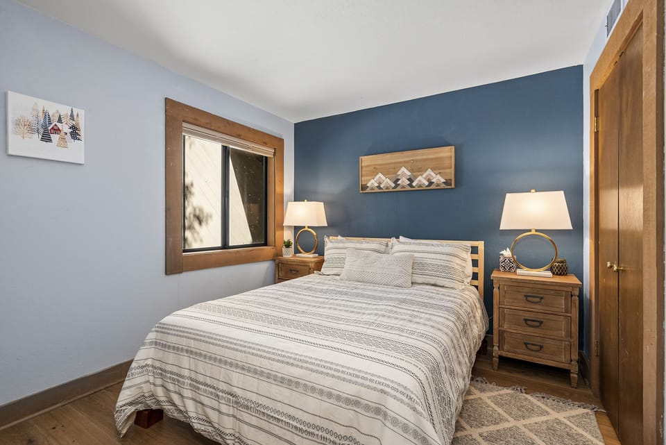 Cozy queen bedroom designed for restful mountain nights.