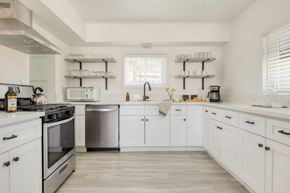 Spacious, modern kitchen with open shelving.
