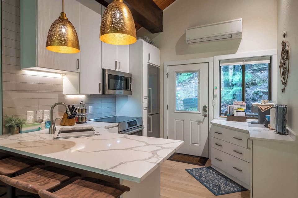 "Welcome to our stylish and fully-equipped modern kitchen, designed to make meal preparation a breeze. This space is perfectly suited for creating delicious home-cooked meals, offering both functionality and a touch of contemporary elegant