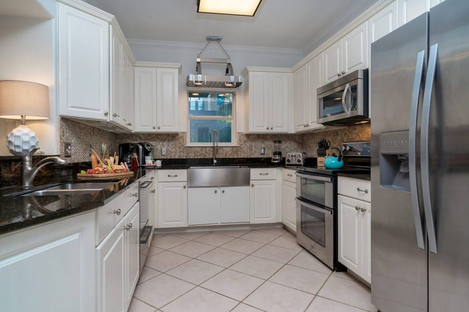 Kitchen with Stainless Steel Appliances; Refrigerator, Electric Oven & Cooktop, Dishwasher & Microwave