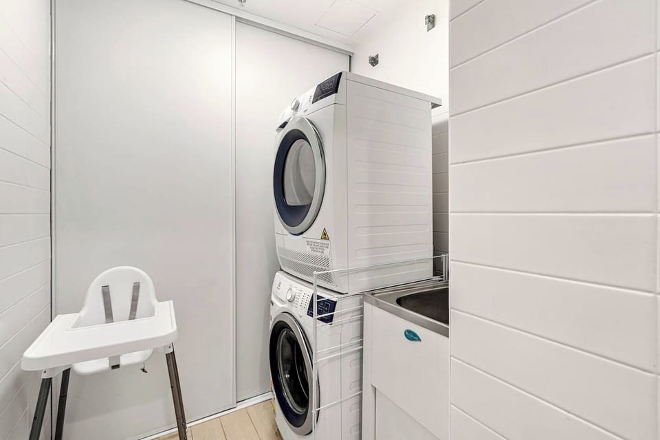Additional conveniences include in-unit laundry facilities with a washer and dryer