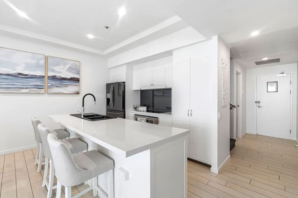 The dining area seats six, with an additional three seats at the kitchen island, and the fully equipped kitchen boasts modern appliances for all your culinary needs.