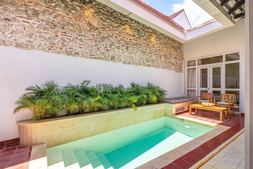Private pool · Tropical garden · Colonial stone walls
