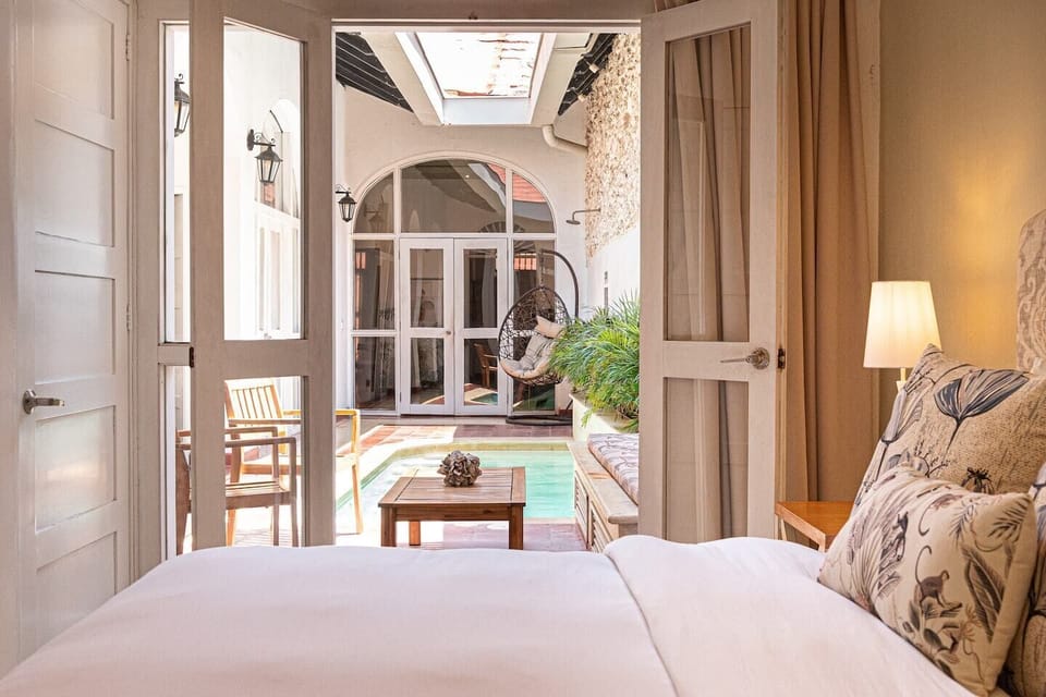 Bedroom 3 · Colonial arched entry · Pool courtyard view